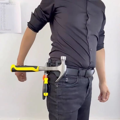 Close-up of a worker's belt showing magnetic tool holder securely gripping a hammer and pliers for hands-free work