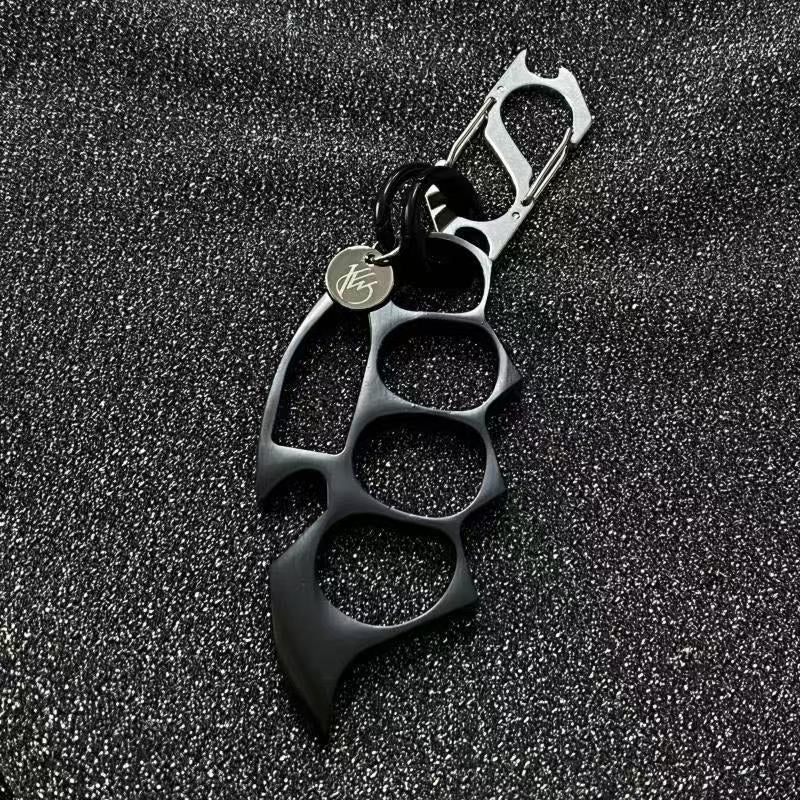 Black keychain EDC knuckle accessory product closeup