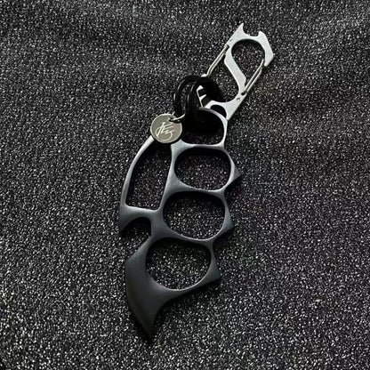 Black keychain EDC knuckle accessory product closeup