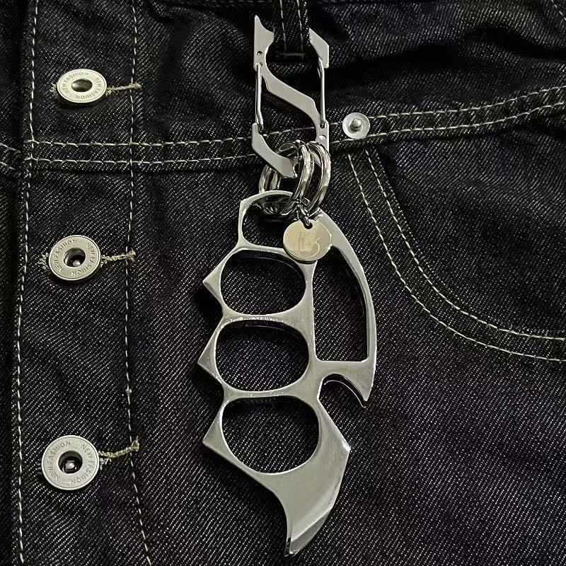 Silver keychain EDC knuckle accessory clipped to belt loop