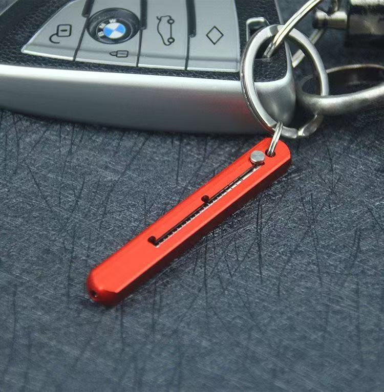 Red keychain pocket toothpick attached to keys