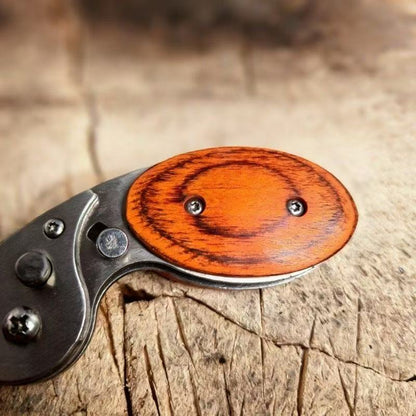 Wood handle detail on mini EDC utility tool